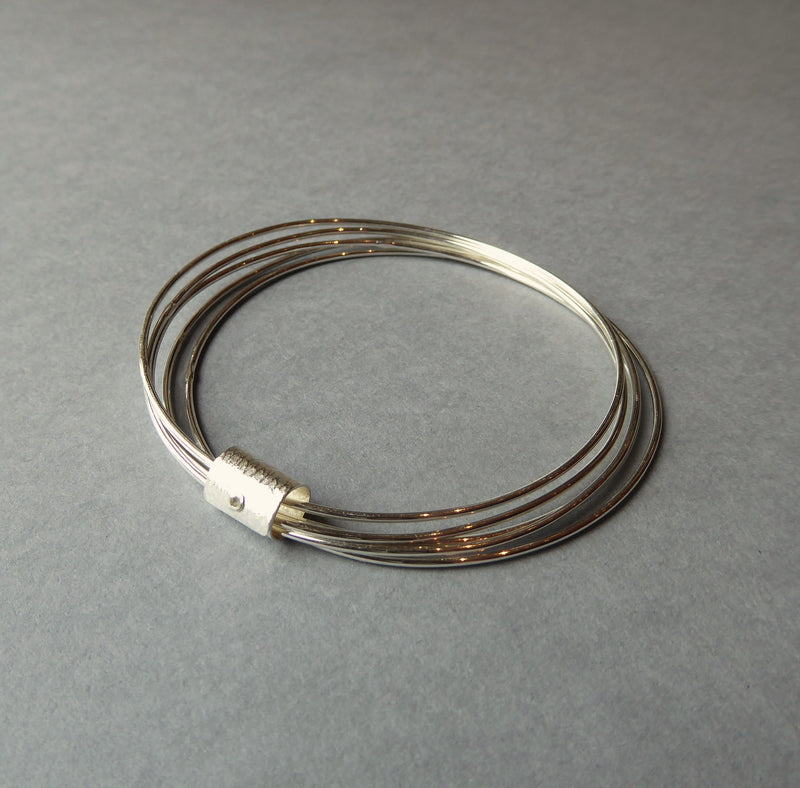 Silver Five Strand Bangle With Print Scroll