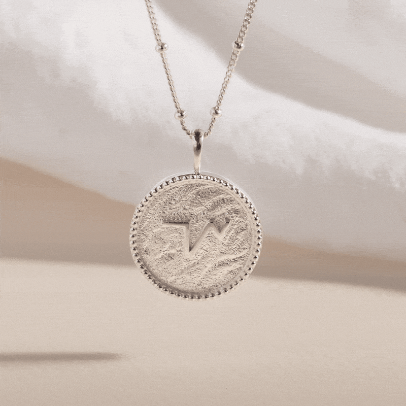 "THRIVE" SHORTHAND SILVER COIN NECKLACE